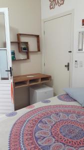 Ένα ή περισσότερα κρεβάτια σε δωμάτιο στο Pousada e SPA Shiva São Sebastião 200mts da praia