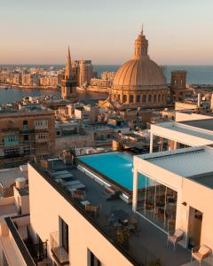 a view of the city of london from the roof of a building at The Embassy Valletta Hotel in Valletta