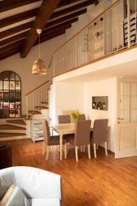 a dining room with a table and chairs at Alla Piazzetta del Castello in Cernobbio