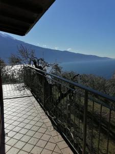 a balcony with a view of the water at Casetta delle olive in Tremosine Sul Garda
