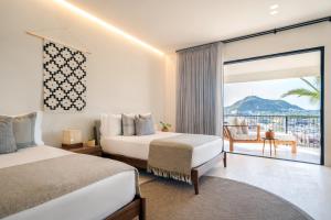 Postel nebo postele na pokoji v ubytování 1 Homes Preview Cabo