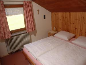 Postel nebo postele na pokoji v ubytování Haus Auracher