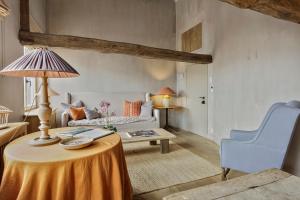 a living room with a table and a couch at Loft Katelijne Luxurious Escape in the Heart of Historic Bruges in Bruges +34 photos