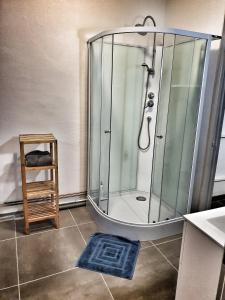 a shower with a glass enclosure in a bathroom at La Résidence du Canal de Bourgogne in Montbard +58 photos