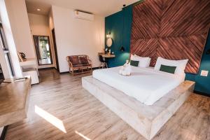 Кровать или кровати в номере Casa Foresta Nan