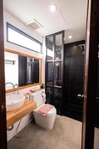 a bathroom with a toilet and a sink at Casa Foresta Nan in Nan +36 photos