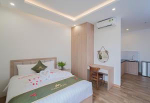 Katil atau katil-katil dalam bilik di Maris Da Nang Hotel & Apartment