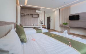 Katil atau katil-katil dalam bilik di Maris Da Nang Hotel & Apartment