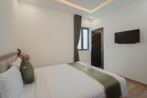 Katil atau katil-katil dalam bilik di Maris Da Nang Hotel & Apartment