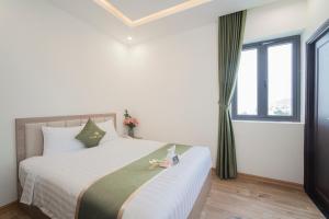 Katil atau katil-katil dalam bilik di Maris Da Nang Hotel & Apartment