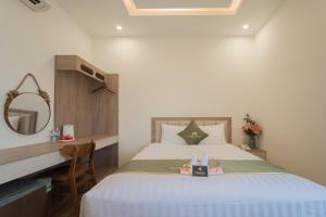 Katil atau katil-katil dalam bilik di Maris Da Nang Hotel & Apartment