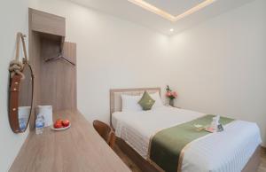 Katil atau katil-katil dalam bilik di Maris Da Nang Hotel & Apartment