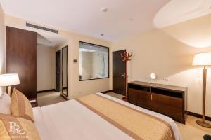 Ένα ή περισσότερα κρεβάτια σε δωμάτιο στο Red River View Hotel