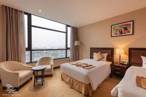Ένα ή περισσότερα κρεβάτια σε δωμάτιο στο Red River View Hotel