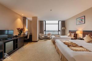 Μια τηλεόραση ή/και κέντρο ψυχαγωγίας στο Red River View Hotel