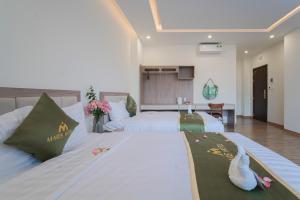 Katil atau katil-katil dalam bilik di Maris Da Nang Hotel & Apartment