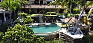 an overhead view of a swimming pool in front of a house at The Spice House Mirissa in Mirissa