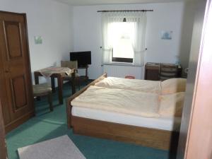 Postel nebo postele na pokoji v ubytování Hotel Die Clus