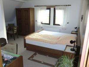 Postel nebo postele na pokoji v ubytování Hotel Die Clus