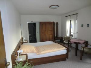 Postel nebo postele na pokoji v ubytování Hotel Die Clus