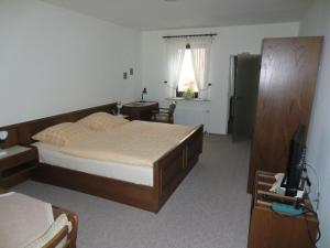 Postel nebo postele na pokoji v ubytování Hotel Die Clus