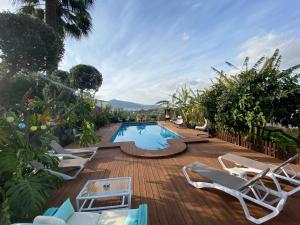 a group of chairs and a swimming pool at Hotel Altea Paradise 1917 - Adults Only in Altea