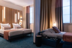 Postel nebo postele na pokoji v ubytování Leonardo Boutique Hotel Paris Opera