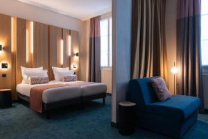 Postel nebo postele na pokoji v ubytování Leonardo Boutique Hotel Paris Opera