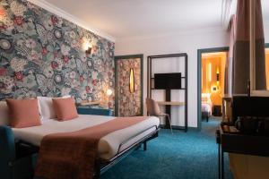 Postel nebo postele na pokoji v ubytování Leonardo Boutique Hotel Paris Opera