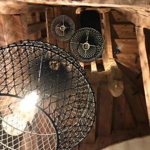 three baskets on the ceiling of a building at Le Mottay Guesthouse in Saint-Père-en-Retz