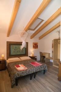 a bedroom with a bed with a net on it at B&B La casa dei gelsi in Loano