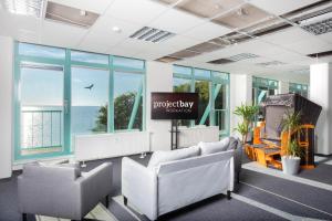 a conference room with chairs and a projection screen at Project Bay - Workation / CoWorking in Lietzow