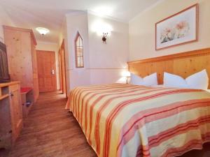 Postel nebo postele na pokoji v ubytování Hotel Sportalm