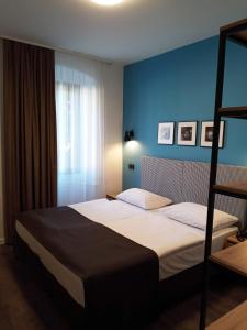 Postel nebo postele na pokoji v ubytování Sabotin, Hotel & Restaurant