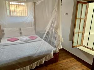 Katil atau katil-katil dalam bilik di Stone Town House