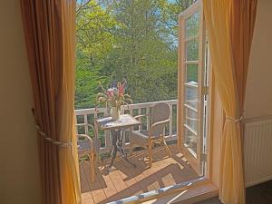 a view of a balcony with a table and chairs at Villa Prinsenhof # Tweeëntwintig in Bergen