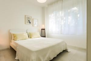 Postel nebo postele na pokoji v ubytování Magnolia - Civico 96