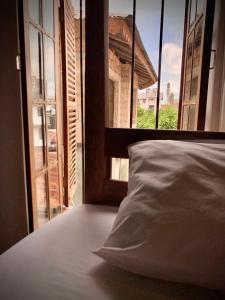 Katil atau katil-katil dalam bilik di Stone Town House