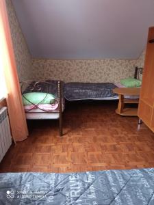Кровать или кровати в номере ГД "Белогорье"