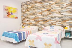 Łóżko lub łóżka w pokoju w obiekcie Chalet Puente Tabla