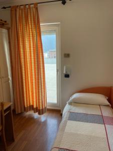 Voodi või voodid majutusasutuse Hotel Culmine toas