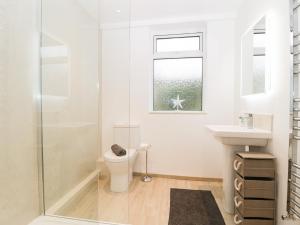 a bathroom with a toilet and a sink at Seaview in Swanage +50 photos