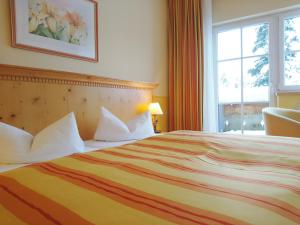 Postel nebo postele na pokoji v ubytování Hotel Sportalm