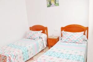 Postel nebo postele na pokoji v ubytování Apartamento Cervantes Conil II + 13 fotografií