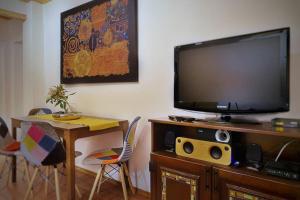 A television and/or entertainment centre at The Secret Lodge- NEW with private GARAGE, entire house