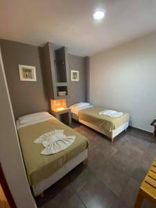 Una cama o camas en una habitación de Eco Plaza Hotel