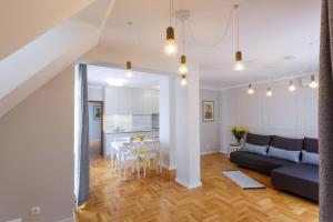 a living room with a couch and a table at Dunav Apartment House in Sofia