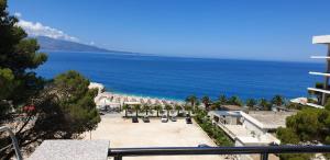 a view of the beach from the balcony of a resort at Eval Hotel in Sarandë