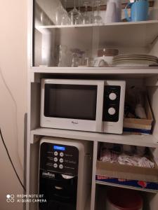 a microwave oven sitting inside of a refrigerator at Art And Relax Suites in Rome