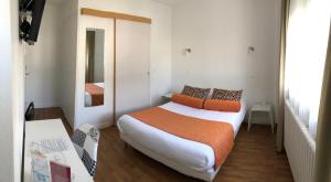 מיטה או מיטות בחדר ב-Cit'Hotel Atlantis
